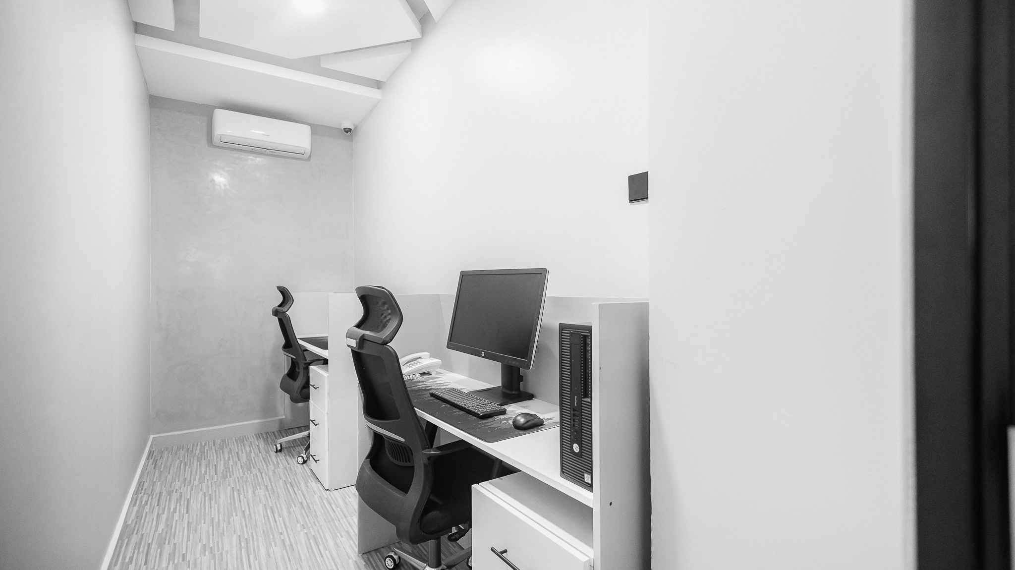 Casual seating area with people working and wall art